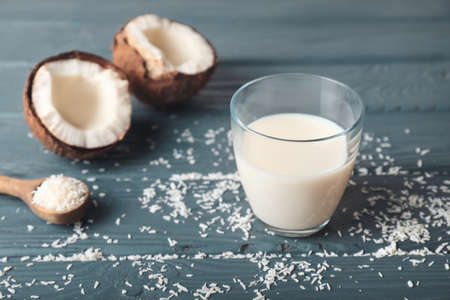 Glass of tasty coconut milk on tableの写真素材