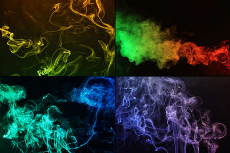 Collage of different color smoke on dark backgroundの写真素材