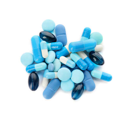 Heap of different pills on white backgroundの写真素材