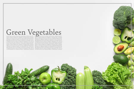 Green vegetables on white background with space for textの写真素材