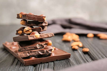 Sweet chocolate with nuts on wooden tableの写真素材