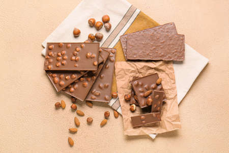Sweet chocolate with nuts on tableの写真素材