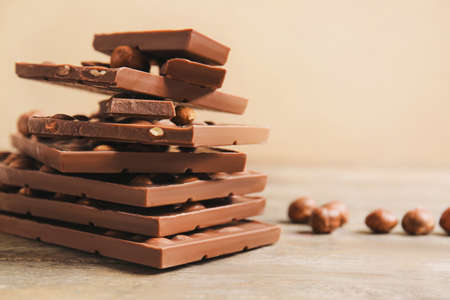 Sweet chocolate with nuts on wooden tableの写真素材