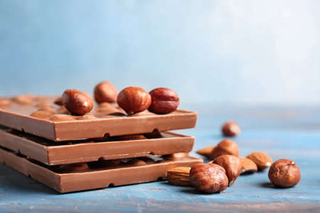 Sweet chocolate with nuts on wooden tableの写真素材