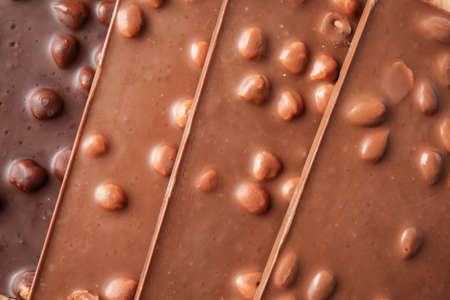 Sweet chocolate with nuts as backgroundの写真素材