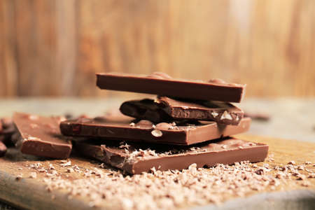 Sweet chocolate with nuts on wooden boardの写真素材