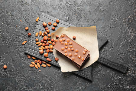 Sweet chocolate with nuts on dark backgroundの写真素材