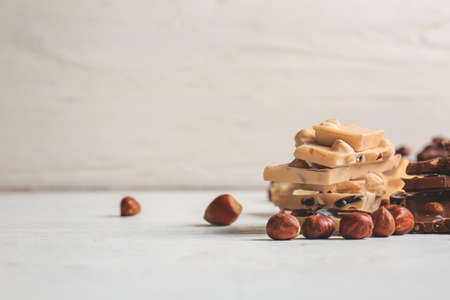 Sweet chocolate with nuts on tableの写真素材