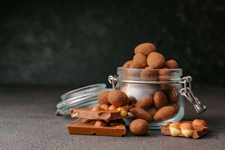 Tasty chocolate with nuts on dark backgroundの写真素材