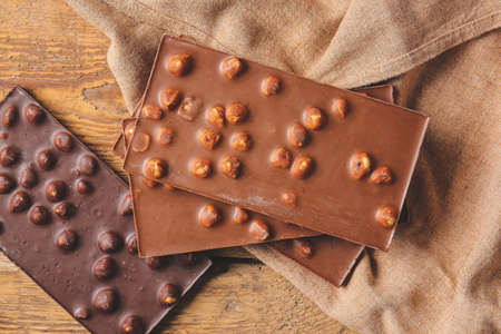 Sweet chocolate with nuts on table