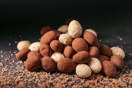Tasty chocolate nuts on dark backgroundの写真素材