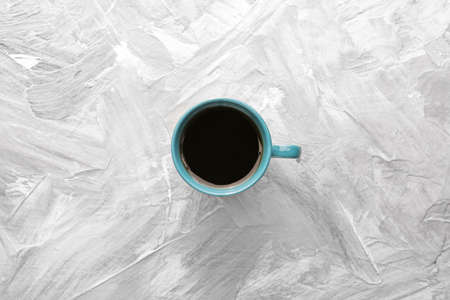 Cup of hot coffee on grunge background, top viewの写真素材