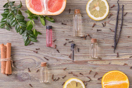 Bottles with essential oils on wooden backgroundの写真素材