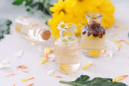 Bottle with essential oil on light backgroundの写真素材