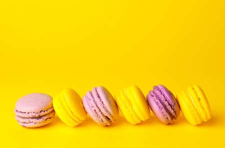 Tasty macarons on color backgroundの写真素材