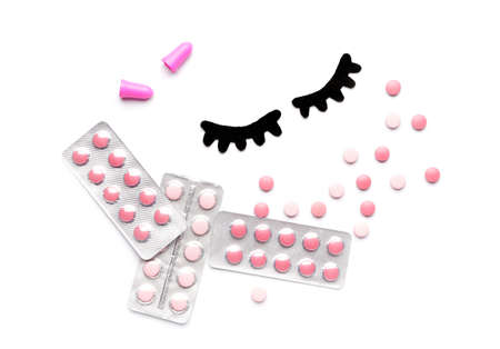 Composition with sleeping pills on white backgroundの写真素材