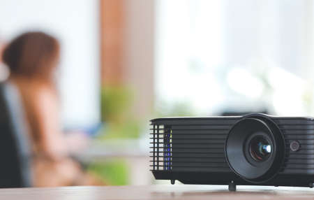 Video projector on table in conference hallの写真素材