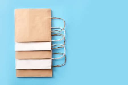 Paper shopping bags on color backgroundの写真素材