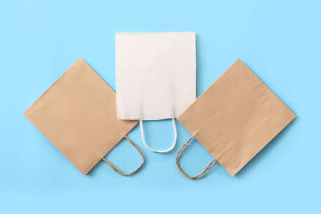 Paper shopping bags on color backgroundの写真素材