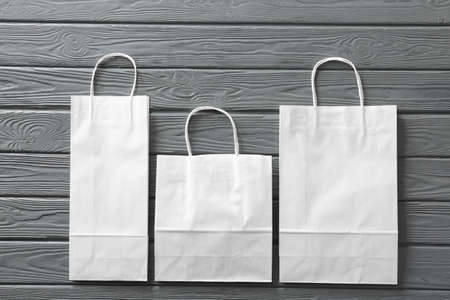 Paper shopping bags on wooden backgroundの写真素材