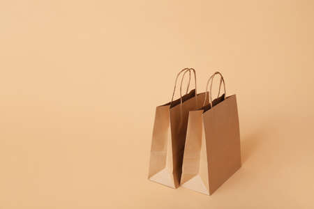 Paper shopping bags on color backgroundの写真素材