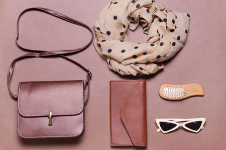 Stylish bag with female accessories on color backgroundの写真素材
