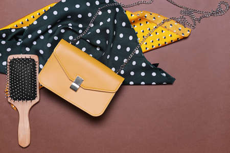 Stylish bag with female accessories on color backgroundの写真素材