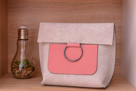 Stylish bag on wooden shelfの写真素材