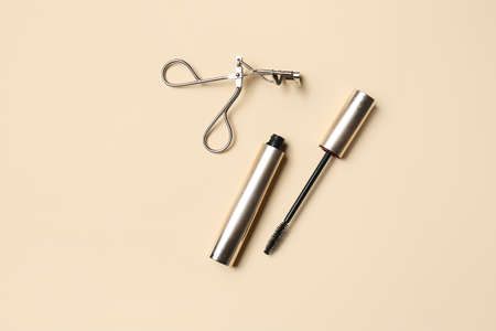 Mascara with eyelash curler on color backgroundの写真素材