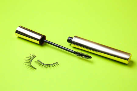 Mascara with fake eyelashes on color backgroundの写真素材