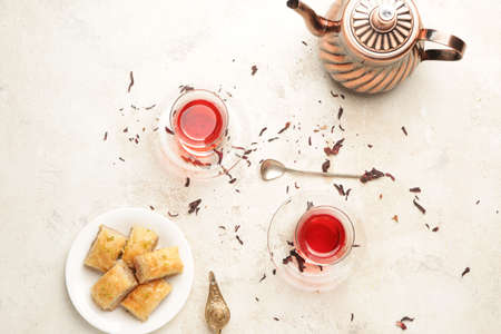 Tasty Turkish tea with sweets on white backgroundの写真素材
