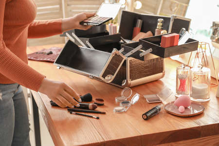 Professional makeup artist with set of decorative cosmetic in caseの写真素材