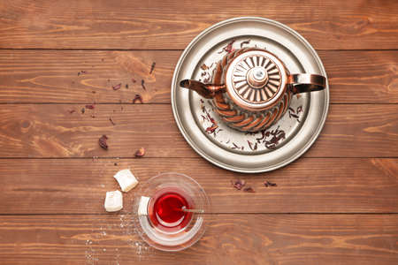 Tasty Turkish tea with sweets on tableの写真素材