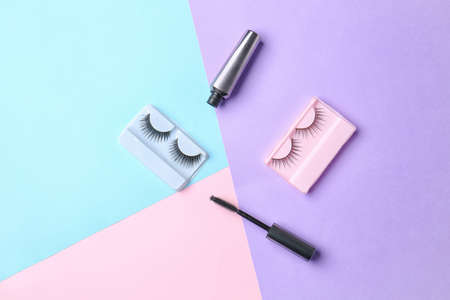 Mascara with fake eyelashes on color backgroundの写真素材