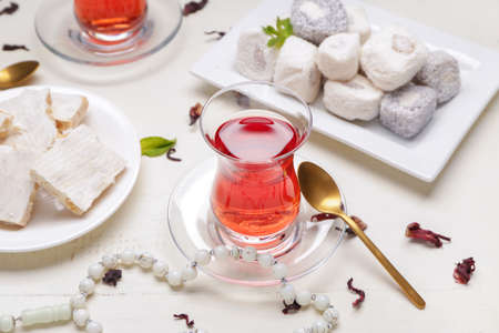 Tasty Turkish tea with sweets on tableの写真素材