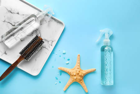 Hair sprays with brush on color backgroundの写真素材