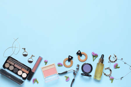 Makeup cosmetics with accessories on color backgroundの写真素材