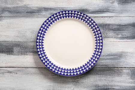 Clean plate on wooden backgroundの写真素材