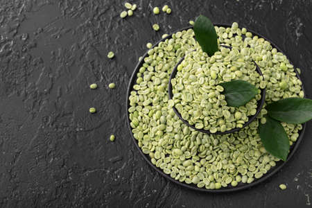 Green coffee beans on dark backgroundの写真素材