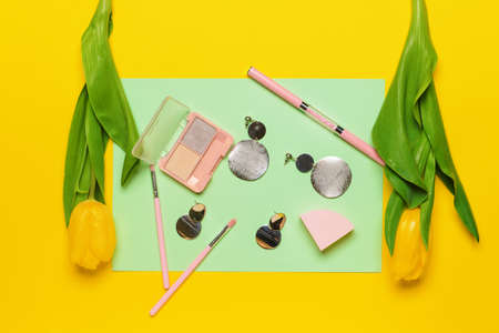 Makeup cosmetics with accessories on color backgroundの写真素材