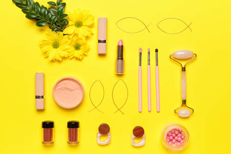 Makeup cosmetics with accessories on color backgroundの写真素材