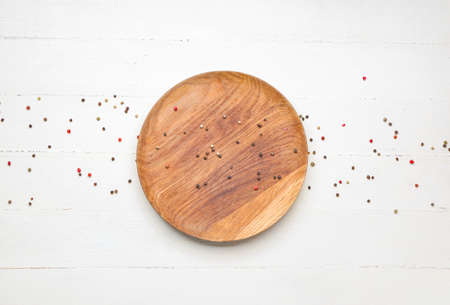 Plate with spices on white wooden backgroundの写真素材