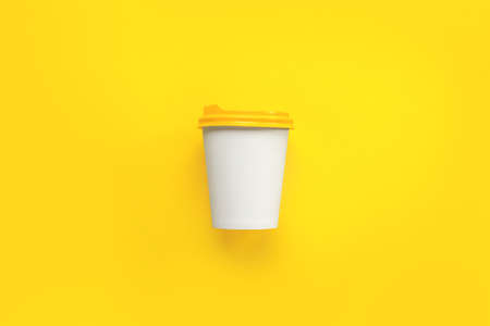 Takeaway coffee cup on color backgroundの写真素材