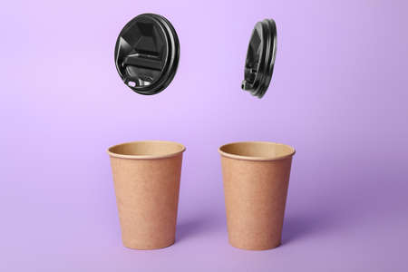 Takeaway coffee cups on color backgroundの写真素材