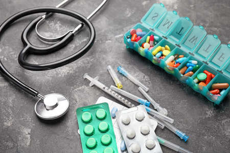 Composition with different pills on gray backgroundの写真素材