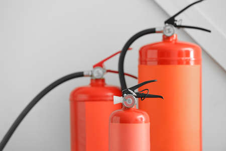 Fire extinguishers on gray backgroundの写真素材