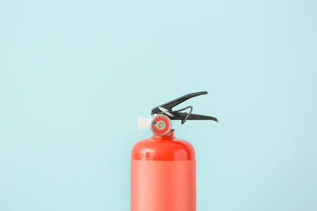 Fire extinguisher on color backgroundの写真素材