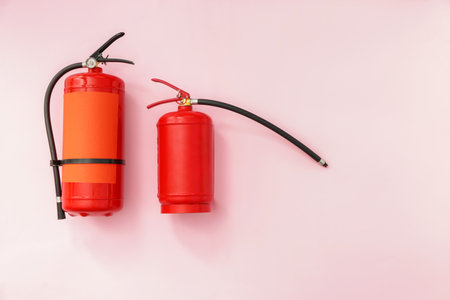Fire extinguishers on color backgroundの写真素材