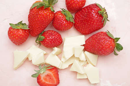 Tasty strawberry and white chocolate on color background