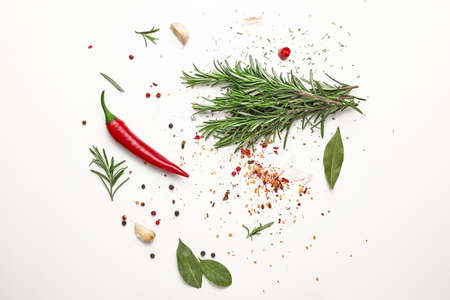 Fresh rosemary and spices on white backgroundの写真素材
